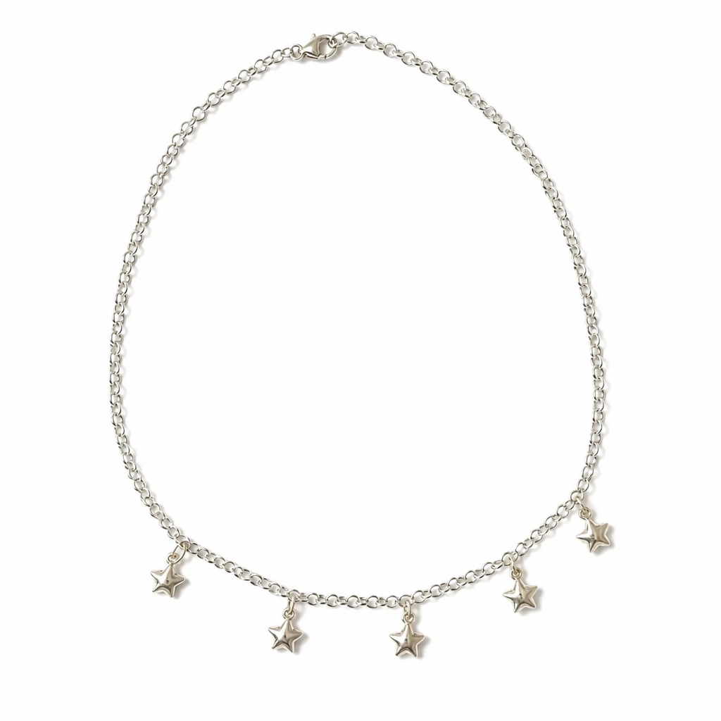 A silver chain necklace with five dangling star charms