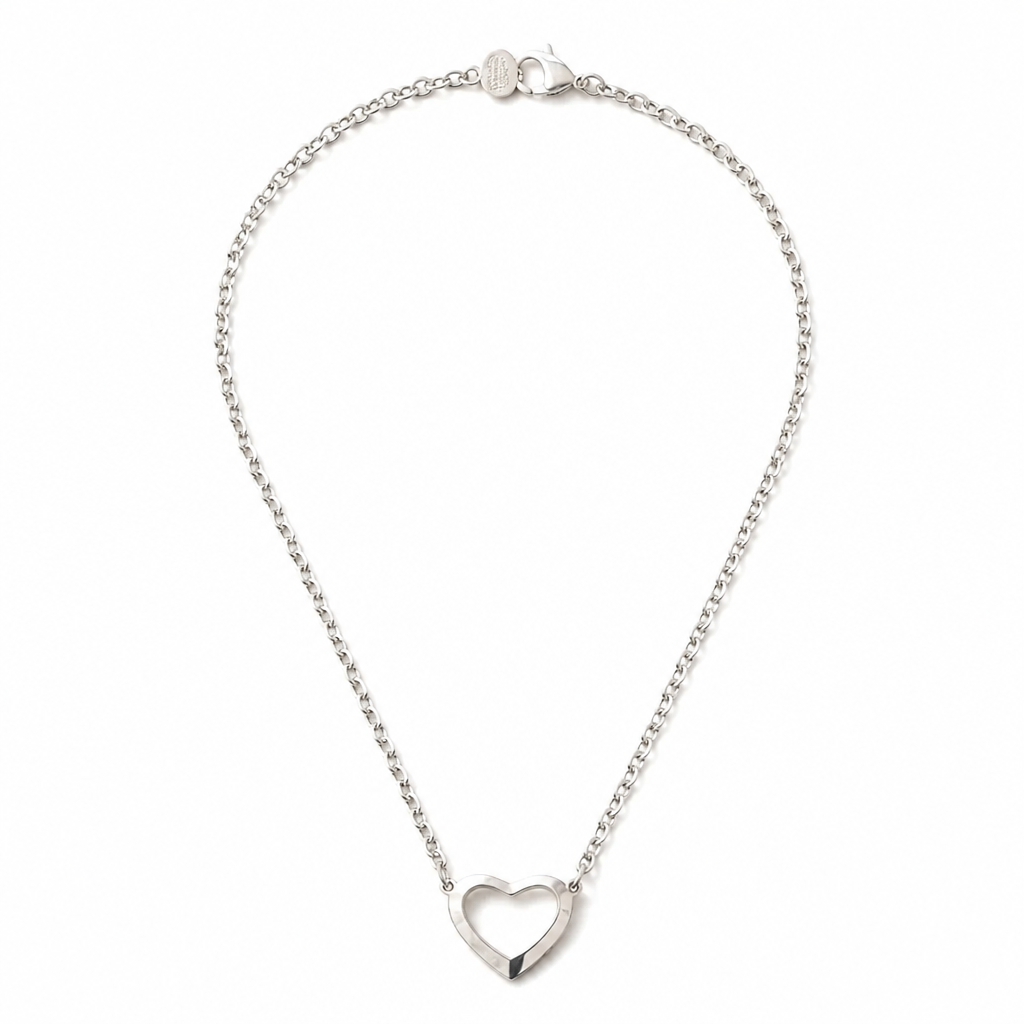 A silver chain necklace featuring a polished open heart pendant