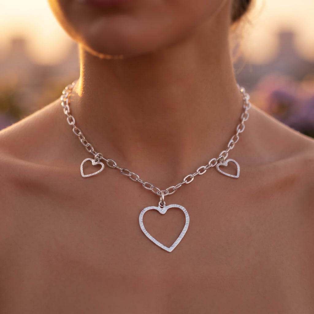 woman with a heart charm hammered necklace 